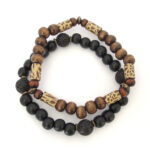 Two bracelets - wood , lava stone, polymer clay and antique brass
