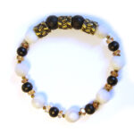 White agate and lava stone compliment this antique brass feature bracelet